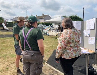public chatting to stand holders at malabar community day