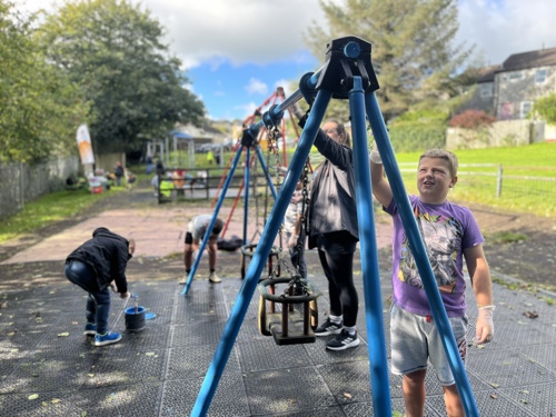 children painting playground equipment at Gunnislake Action Day