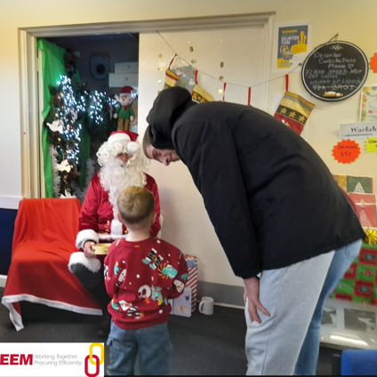A child waiting to see Father Christmas at Oakland's Christmas community event in Saltash
