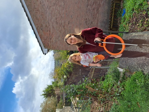 Natasha and her daughter with their new litter picking equipment