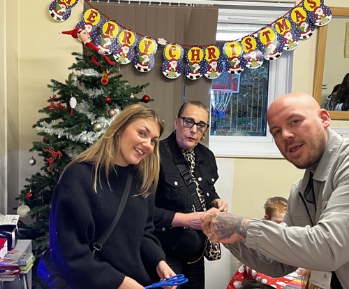 cardo employees smiling for the photo at the Christmas event
