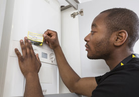engineer-applying-annual-service-sticker