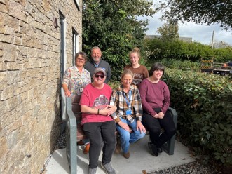 Cornwall Housing, WMS and Haven Care staff celebrate the new bench with residents of Crow's Nest, Penzance