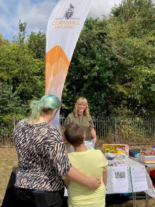 Cornwall Housing stand with branded flag at community day