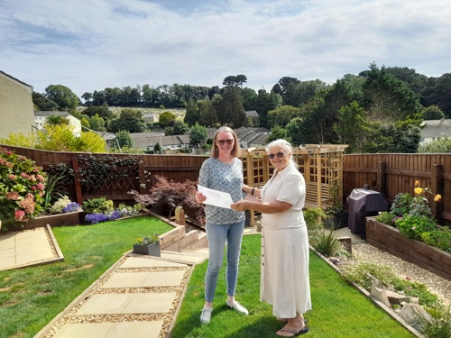 Photo of June, one of the judges, presenting Elaine with her certificate