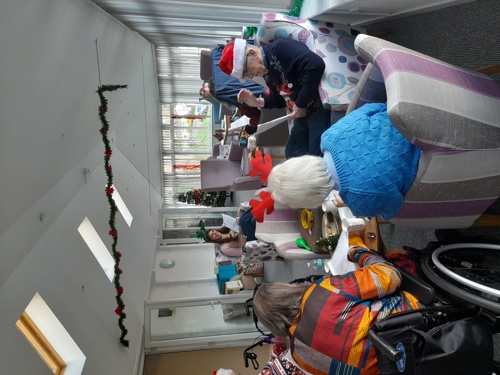 A photo of our Independent Living residents singing with our engagement officer