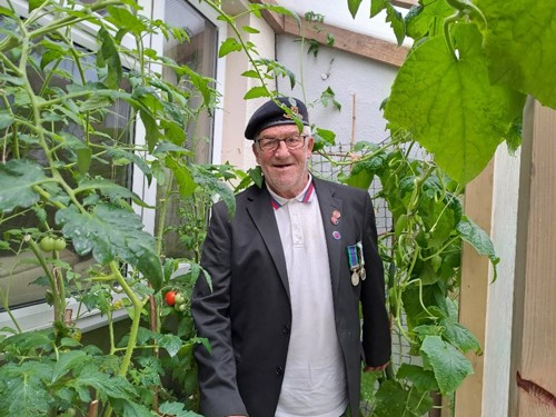 pictured Derek in his greenhouse